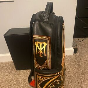 Sprayground Black Backpack with Gold Detailing